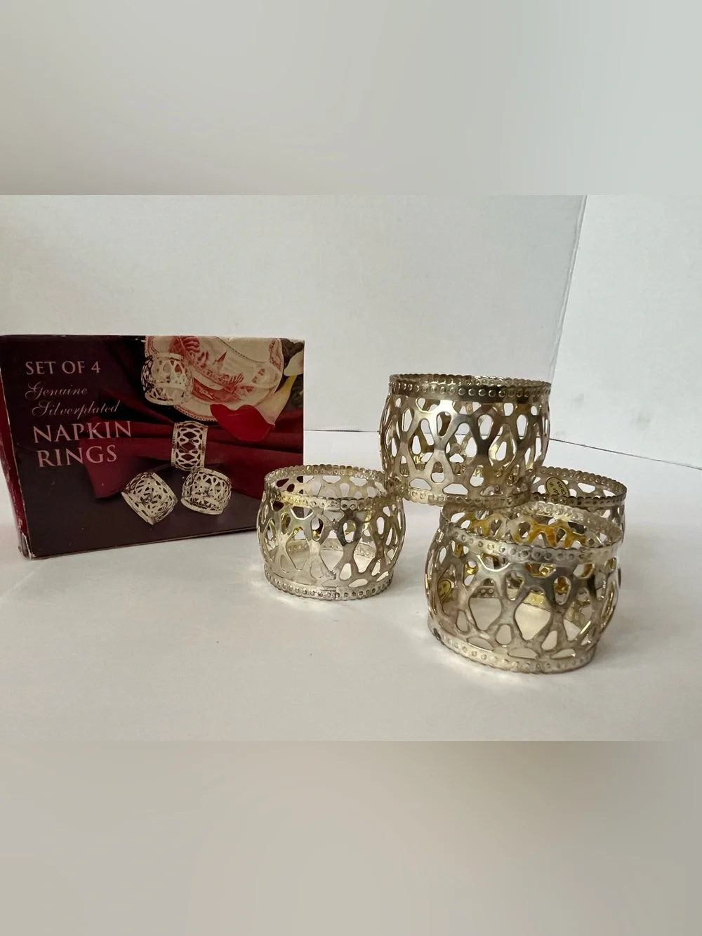 Unbranded Napkin Ring Set of 4 in box.  Beautiful silver plated 1 1/4 